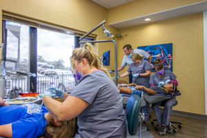 Orthodontic assistant providing care to a patient.